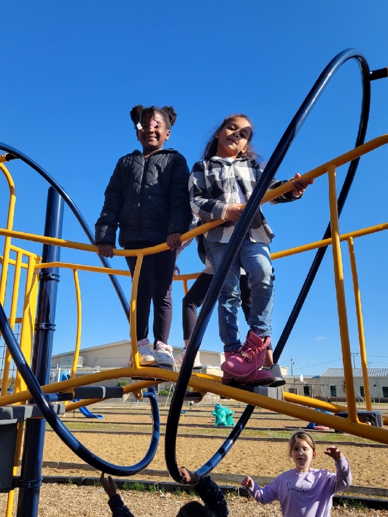 Soaking up the sunshine on the playground before the cold sets in for a while!